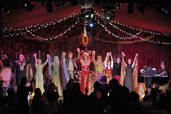 The Teatro ZinZanni cast finish a show under the Spiegeltent.